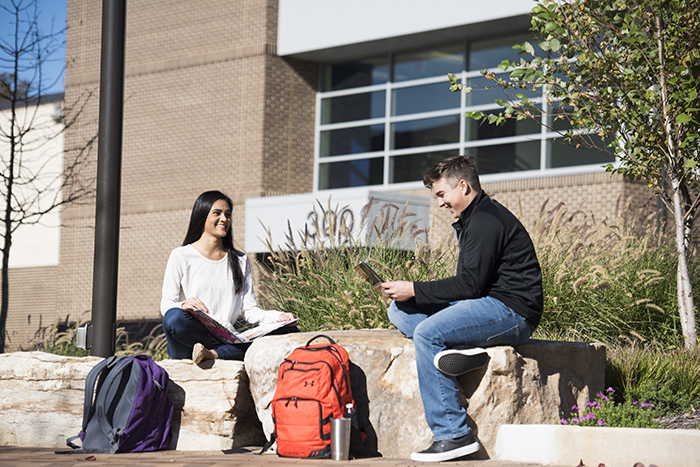 Two students studying outside